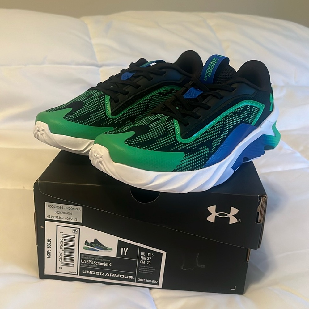 New in box. Boys green and black Under Armour shoes. Youth size 1
